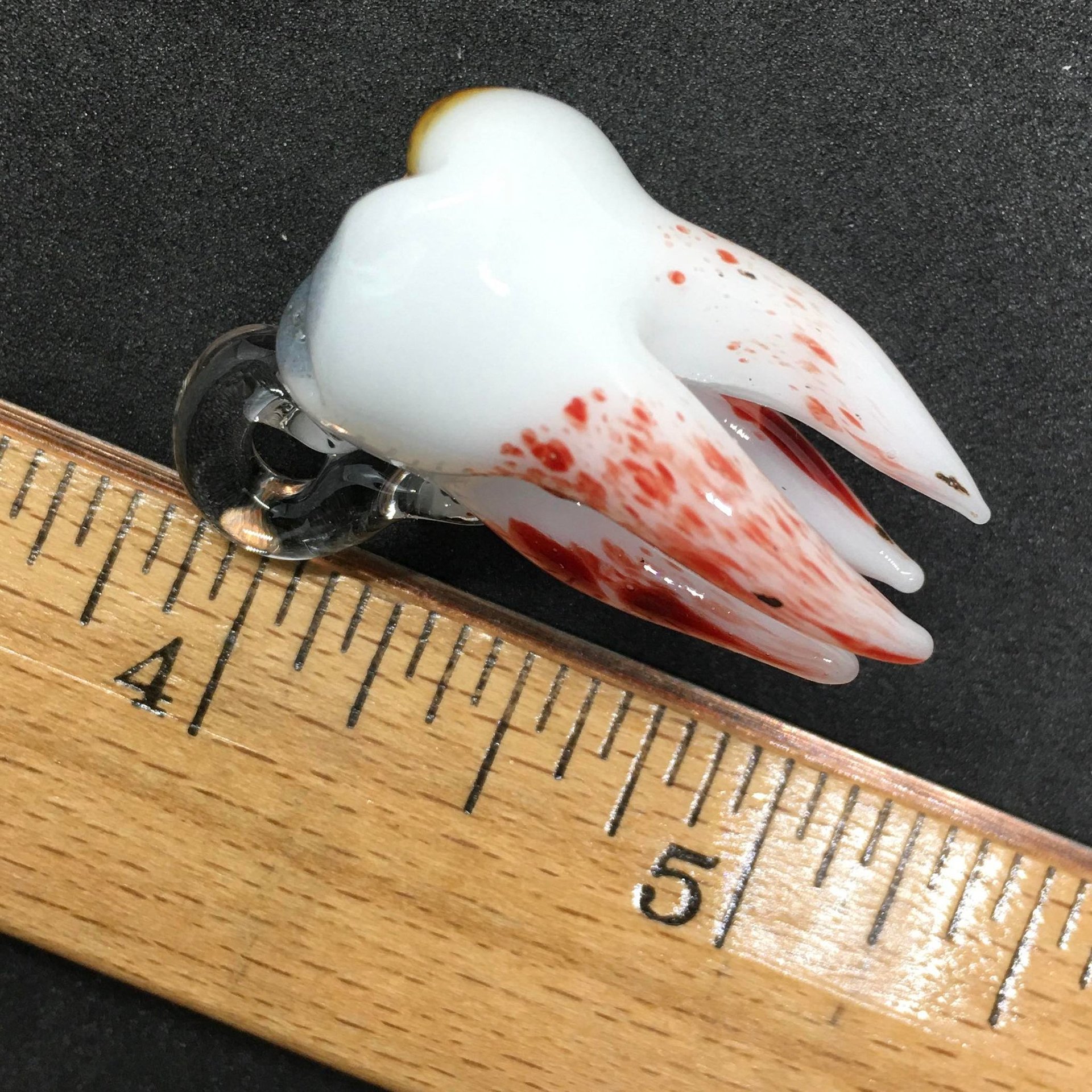 Pulled tooth pendant